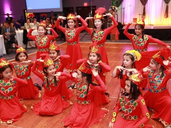 Students performing a traditional Uyghur dance in costume